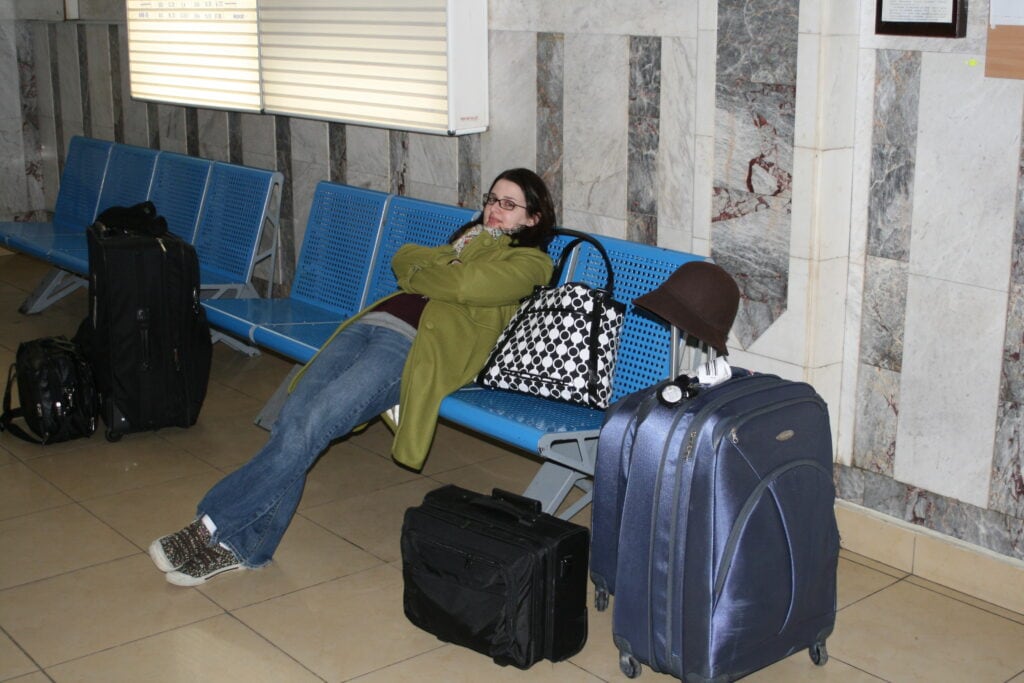 example of overpacking - photo of Adrienne in a Ukraine airport with too much luggage