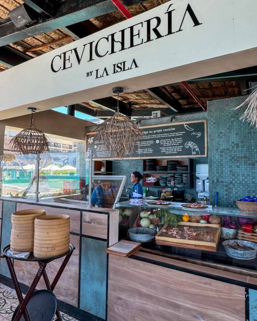 Cevicheria By La Isla restaurant menu board and fresh fish counter