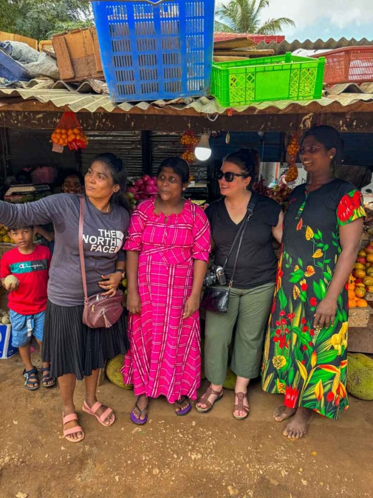 taking a selfie with fruit sellers in the Jaffna market
