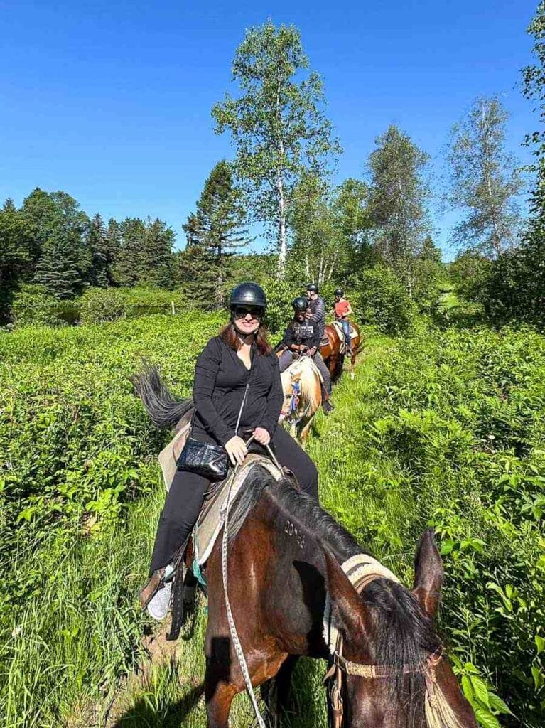 Adrienne horseback riding at Le Baluchon eco-villegiature