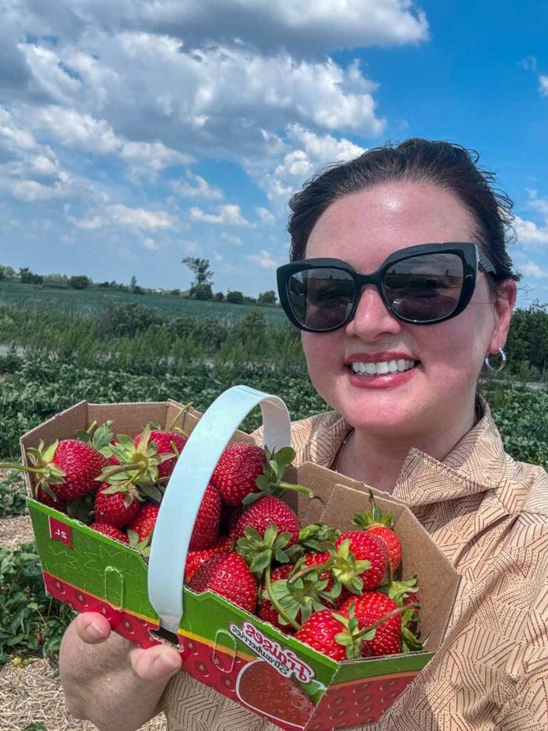 Adrienne with her u-pick strawberries at Ferme Forget