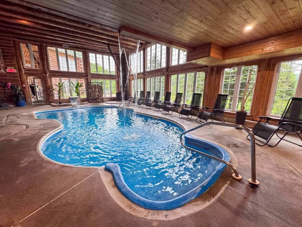 indoor pool with waterfall at Auberge du Vieux Moulin